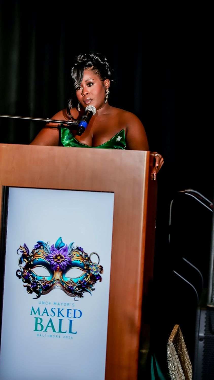 Jessica at the podium at the UNCF Mayor's Masked Ball in Baltimore